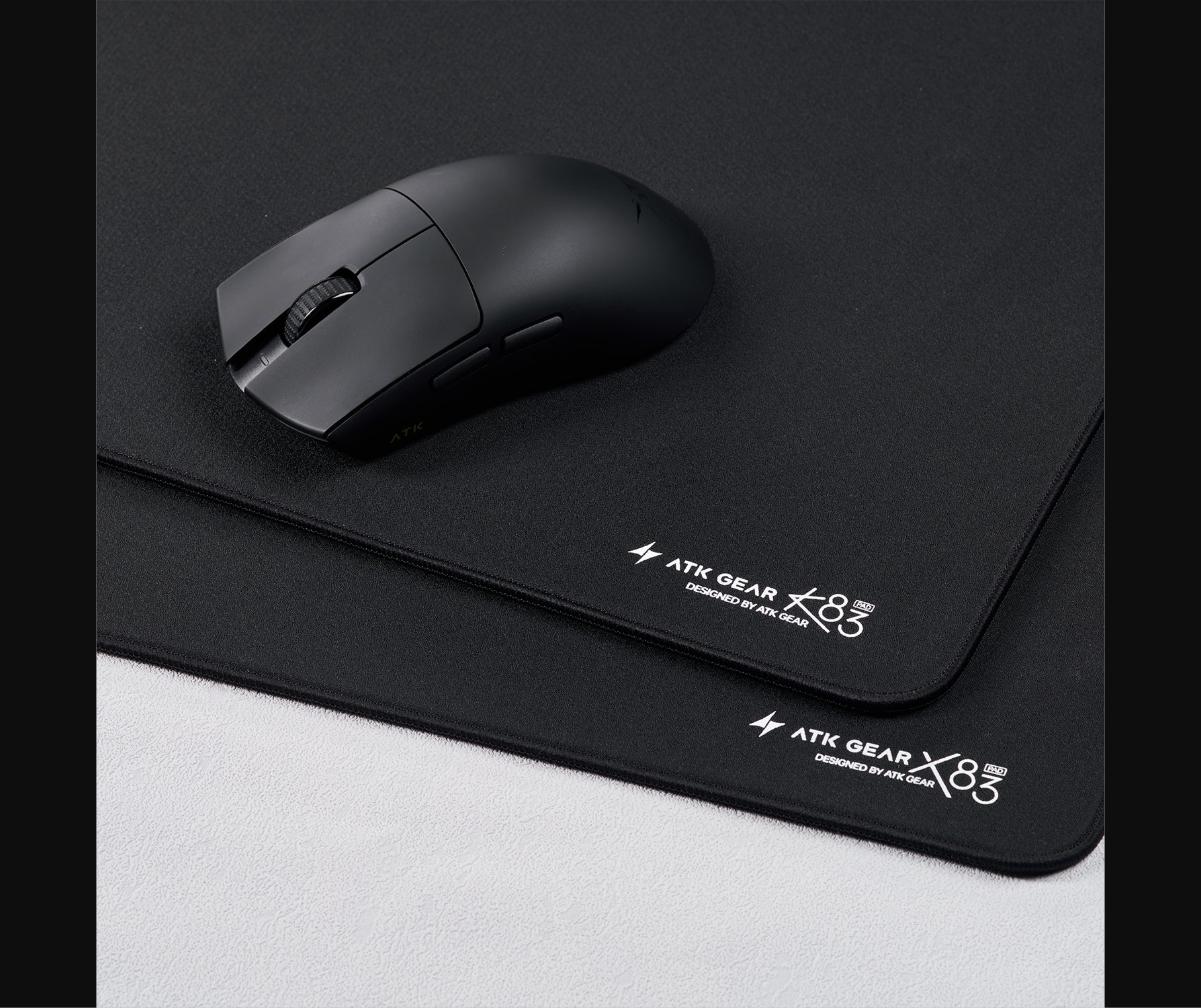 ATK Blazing Sky F1 in hand — showing the 35g symmetrical body, Ice-Feel coating surface, and overall compact proportions designed for claw and fingertip grip styles.